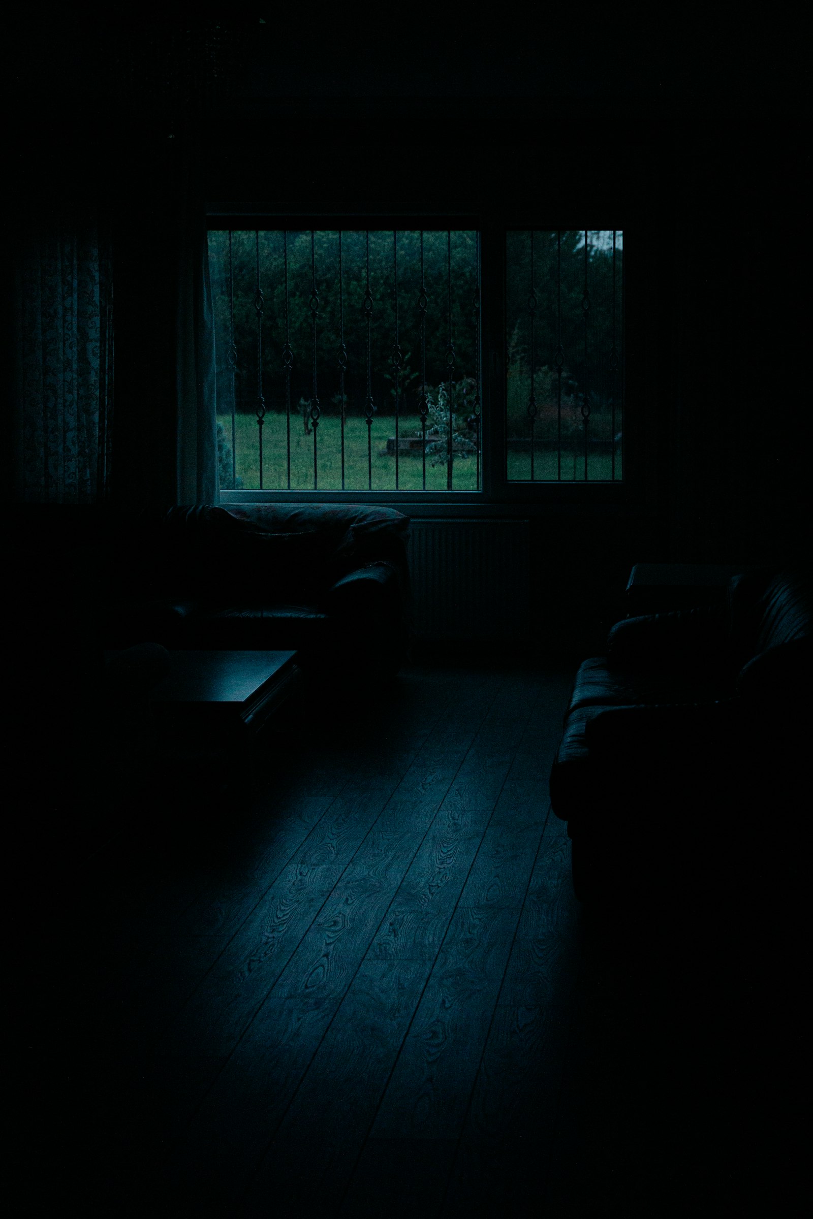 A car interior at night with city lights blurring past