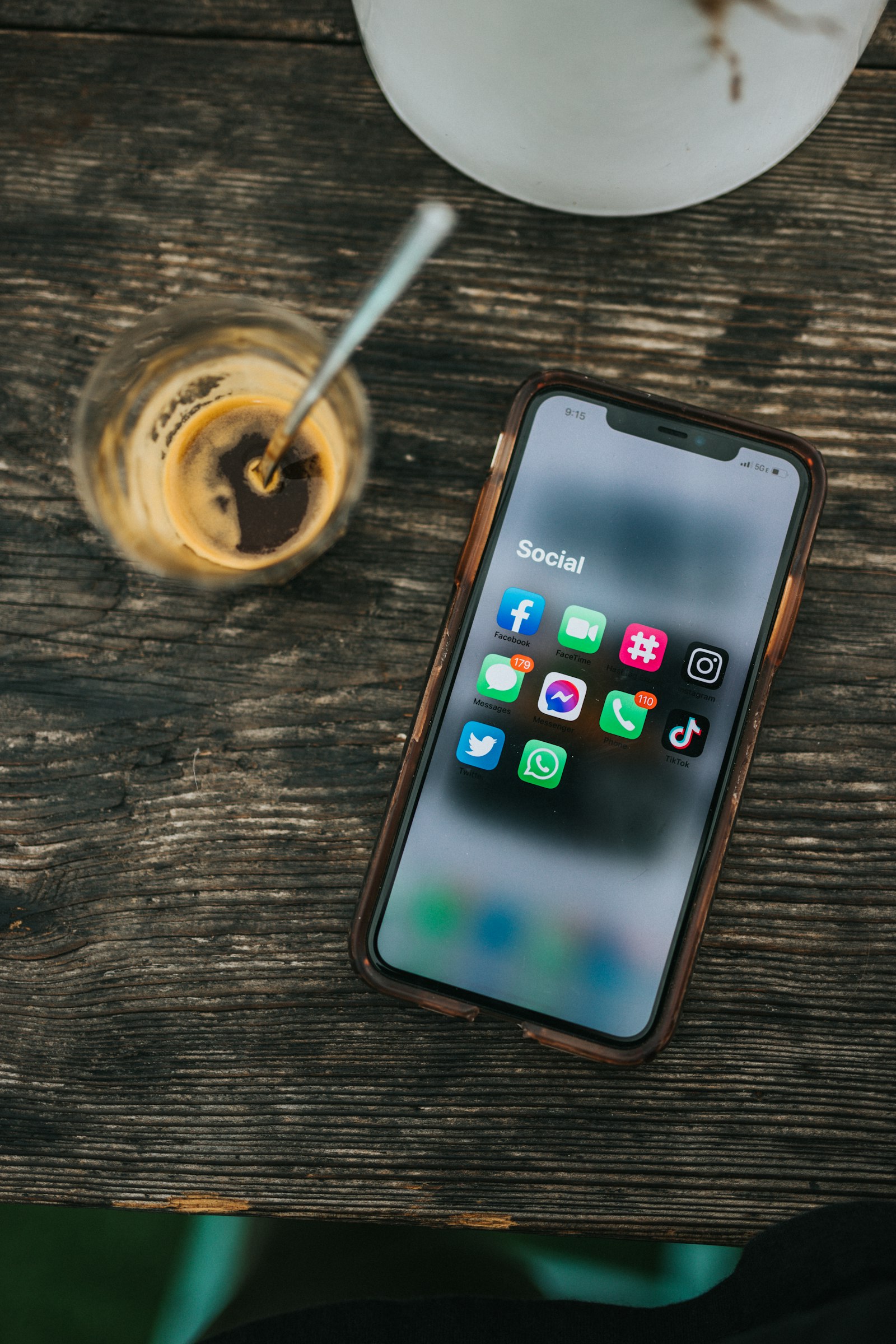 A phone framed against a mirrored surface